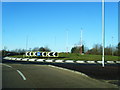 Roundabout on A484 with distinctive theme in SA14 9SW