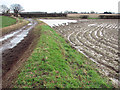 Flooded field and muddy track by Hemblington Hill in Hemblington