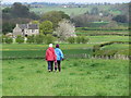 Walking on field path towards Throstle Nest Farm near Mayfiel in DE6 2BP