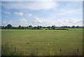 Flat farmland by the railway line in TN27 9NY