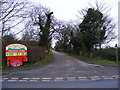 Cliff Farm Lane & entrance to Heathland Caravan Park in NR33 7PN