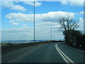 A5026 looking to the Dee estuary and Liverpool beyond in CH8 9ER