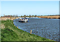 Boat travelling up the River Bure, Acle in NR13 3AZ