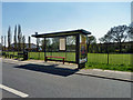 Bus shelter and playing field in CM11 2HN