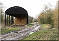Dutch barn alongside footpath in IP22 2ES