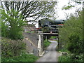 Steam train crosses a bridge near Harman's Cross in BH19 3JB