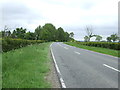 A631 approaching a bend near Rectory Farm in West Rasen