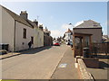 Station Road Oxton, with bus stop and bus in TD2 6PP