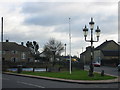 Pond, sign, flagpost and fancy streetlamp in PE28 2TQ