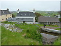 Houses and a dammed spring in Hoswick, Shetland in ZE2 9HL