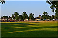 Evening shadows across the village green at Send in GU23 7BJ
