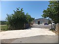 Modern farm building north of Chudleigh Knighton in TQ13 0EL