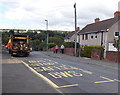 Relining of bus stop road markings complete, Badminton Grove, Ebbw Vale in NP23 5PX