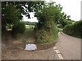Road, farm gate and farm track at Sexton's Cross in EX6 7PY