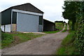 Farm building beside steep track in SP5 1RJ