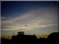 A Memorial Flight Spitfire approaching the Lincolnshire Aviation Heritage Centre Control Tower in East Kirkby