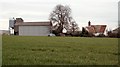 Looking across a field to Goddards Farm in CB10 2RU