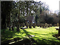 Gatehouse and churchyard, Wimborne St Giles in BH21 5LZ