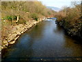 Afon Afan flows towards a footbridge south of Cwmavon in SA13 2EY