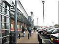 Shoppers on the forecourt of the St David's Retail Park in LL57 1LA