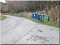 Bins lined up at the roadside near Easter Brae in IV7 8LW