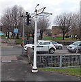 Black-gloved signpost arms, Fairwater, Cardiff in CF5 3PS