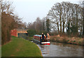 Canal boat approaching Steer Bridge in Marbury and District