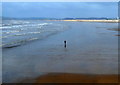 Solitary walker on Aberavon Sands in SA12 6AN