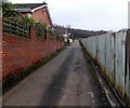 Between wall and fence in Treforest in CF37 1UH