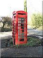 Smashed up K6 telephone box in NR32 5PQ