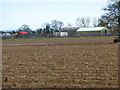 Park Farm buildings seen across field in PO20 1LL