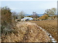 Footpath approaches Butterlees Farm from the south in PO20 1LL