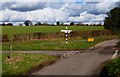 Signpost at junction of lanes on High Cross Lane in GU32 1ER