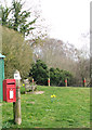 Seat and postbox by the junction of Ringland and Taverham Lanes in NR8 5AW