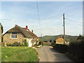 Cottages and overhead wires at North Chideock in DT6 6JY