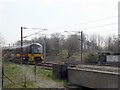 Train approaching bridge over Wellington Road in LS3 1EF
