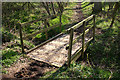 Footbridge on the edge of Lenborough Wood in MK18 4HF
