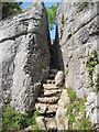 Cleft in the limestone cliff known as the Fairy Steps in LA7 7BD