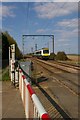 Level crossing at Little Thetford, with 'One' train from Norwich to Cambridge in CB6 3HZ