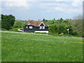 House on the Little Woodcote Estate seen from Grove Lane in CR5 2QJ