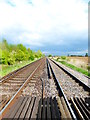 Looking east along railway from footpath in BN18 0DH