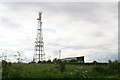 Communications mast and shed with graffiti by Derby Road in NG17 7EB