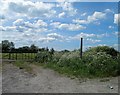 Field gate and footpath signpost near Wickwar in GL12 8LB