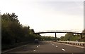 A78 approaching footbridge near cemetery in KA11 1BJ