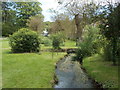 Waterston: the Piddle enters the manor house gardens in DT2 7SR