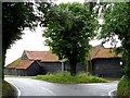 Barns at a junction of country lanes in CM16 6AU