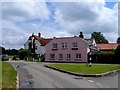 Houses and signpost, Matching Green in CM17 0PT