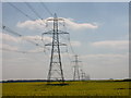 Electricity pylons across open farmland in CB11 4EY