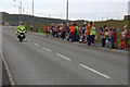 Motorcycle outrider ahead of the Queen's Baton Relay at Brae in ZE2 9SN