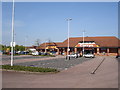 Part of Retail Park to the West of carpark in TN24 8XH